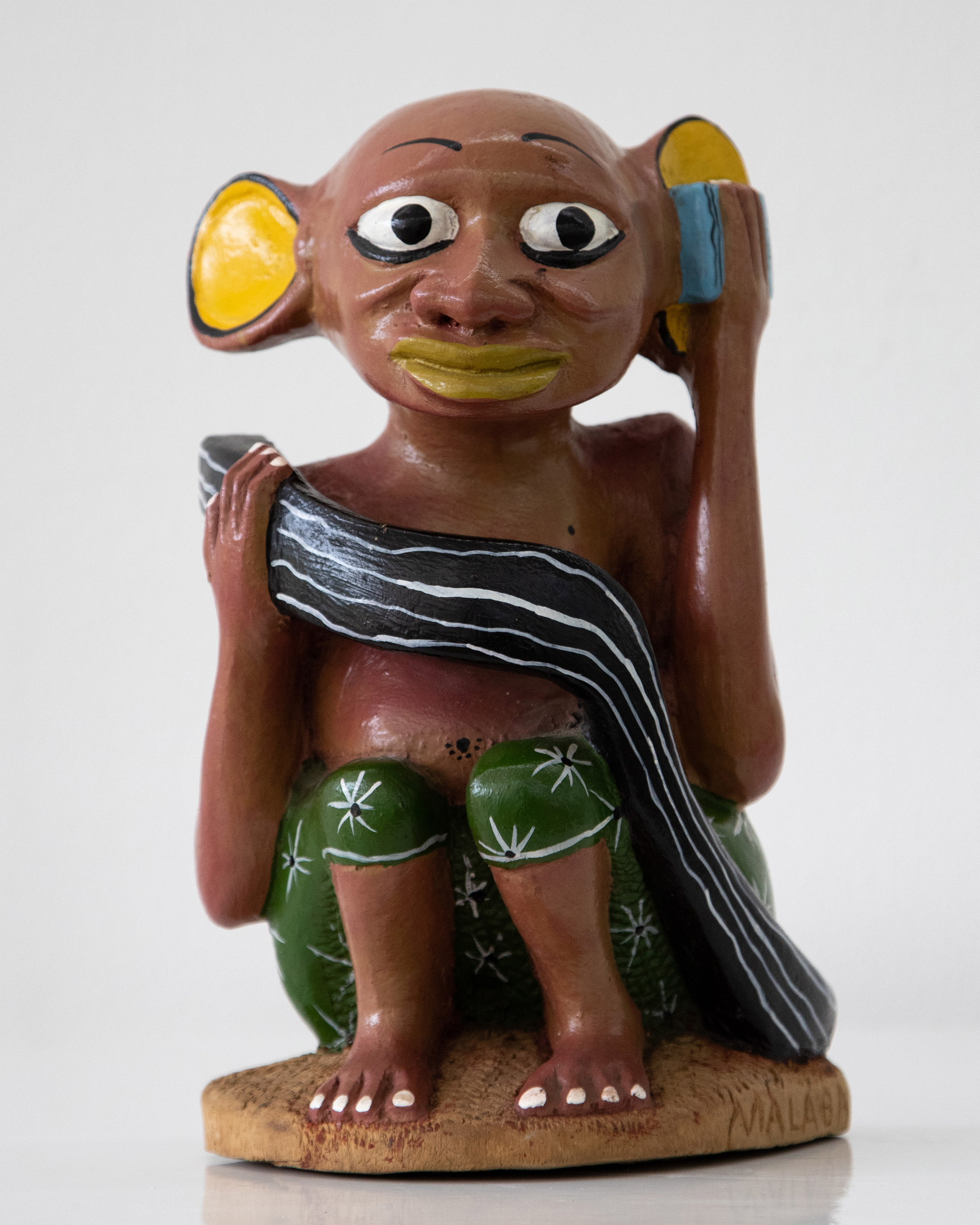 Lot 21 — Augustino Malaba, Untitled, (Listening to the Radio), circa 1990s