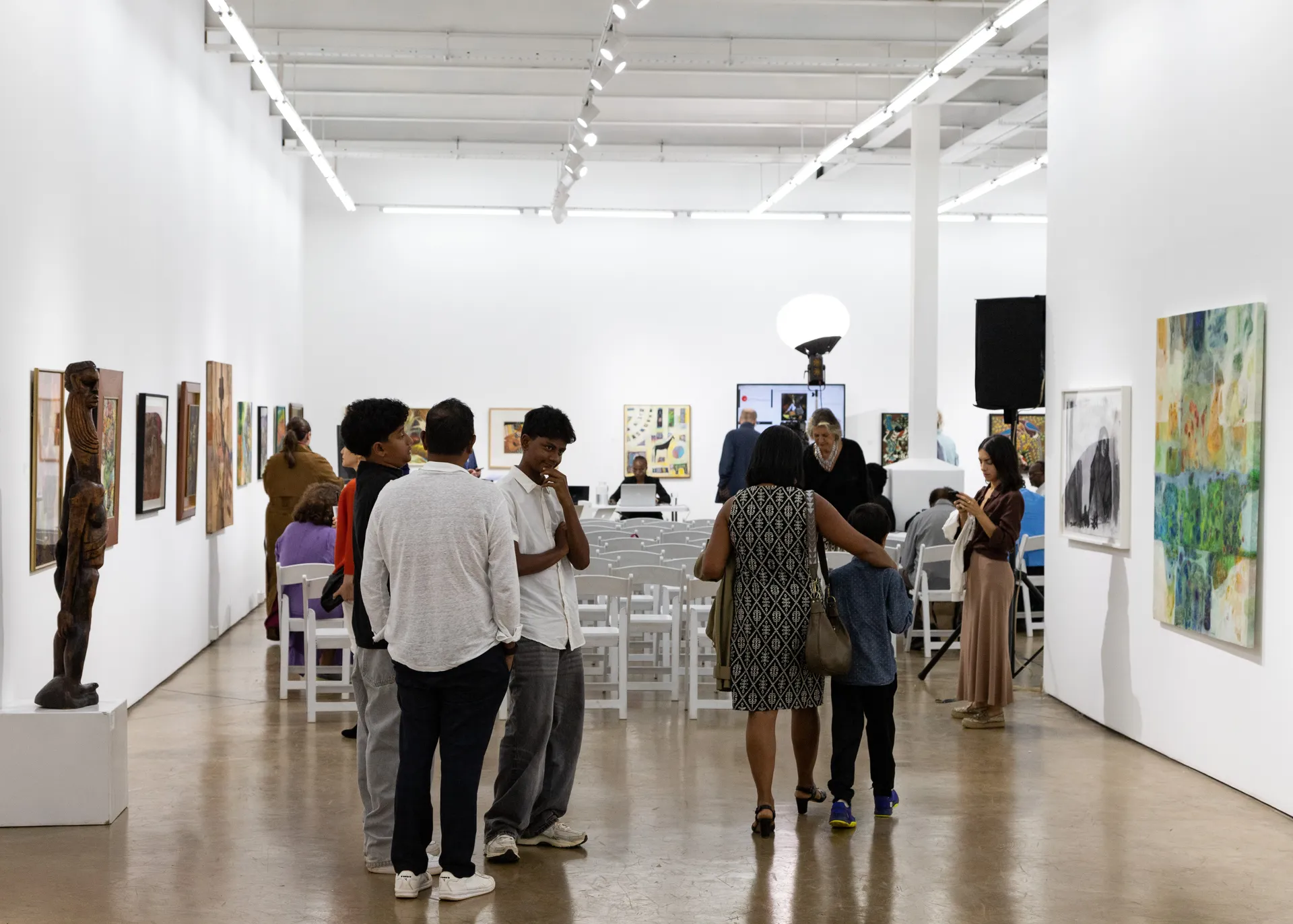 Visitors viewing works before the 2025 auction